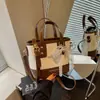 Bolsa Pequena Transversal Estilo Coreano Feminina Chegada Nova Verão 2026 Bolsa de Mão de Nicho Cor Personalizada Bloqueio de Cores Bolsa de Balde Simples