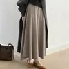 Falda midi de punto minimalista estilo coreano para mujer, nueva colección otoño/invierno 2026, de cintura alta, adelgazante, corte holgado, falda línea A suave y cómoda con dobladillo acampanado