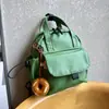 Mochila pequeña ligera y linda, versión de cuero impermeable, bolso de mano pequeño, mochila de moda impermeable versátil