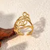 Venta caliente chapado en oro de 18 quilates sin decoloración presión de aceite temperamento elegante acero inoxidable de alta calidad línea retorcida anillo abierto