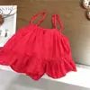 Vestido de tirantes estilo vacacional para niña estilo coreano con bordado rojo y diseño calado, top de verano moderno y pantalones de pierna ancha para exportación