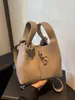 Bolso de Mano Retro de Nicho Transfronterizo Nuevo Bolso de Hombro Simple de Color Sólido Estilo Hong Kong Bolso Cruzado Tipo Cubo Bolso para Madre