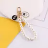 Estilo Nuevo de Primavera Chanel Perla Cadena de Mano DIY Hecho a Mano Bolso Casero Funda para Teléfono Móvil Llavero Accesorios