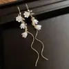 Brincos de flor de lírio-do-vale estilo pastoral francês com borla longa, um design luxuoso e elegante, nova coleção 2026