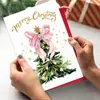 Novo design transfronteiriço: um cartão de Natal com um único laço rosa e envelope, perfeito para votos e mensagens de fim de ano