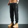 Colección de primavera y otoño transfronteriza: pantalones de trabajo modernos para hombre, largo cropped, versátiles y de corte holgado, con puños elásticos, estilo casual
