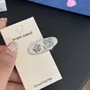 Presilha de cabelo oval de metal prateado, design minimalista de nicho estilo coreano, acessório de cabelo de presilha para franja moderno e único para mulheres