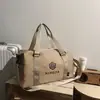 Bolsa de viagem de moda transfronteiriça nova de grande capacidade, moderna, casual, portátil, bolsa de ginástica, bolsa de ombro para armazenamento de bagagem, comércio exterior