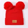 Gorro de lana tejido para niños, color liso, otoño e invierno, con doble pompón, cálido y protector de orejas, versátil y lindo, adecuado tanto para niños como para niñas