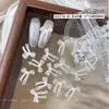 Accesorios de moño para decoración de uñas transparentes tallados suavemente, populares en Xiaohongshu, decoraciones de moño de cinta impresas esmeriladas para uñas