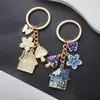 Llavero de Flor Azul de Esmalte Creativo Transfronterizo, Mariposa, Casa de Hongos, Llavero de Nicho Lindo, Accesorio para Bolso, Colgante