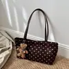 Bolso de mano, bolso de hombro y bolso de axila nuevo estilo coreano, de nicho y exquisito para el trabajo, con diseño de bolsa tote de lunares para mujer, 2026