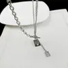 Collar en forma de corazón para hombres y mujeres, collar de acero de titanio con borla, cadena para suéter con colgante apilado de doble capa estilo ins versátil hip-hop personalizado