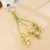 Accesorio de mochila decorativo estilo Miu de osmanthus dorado creativo, colgante de bolsa versátil y exquisito de cuero PU, adorno colgante, regalo