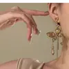 Nuevos Pendientes de Mariposa de Cristal Estilo Maillard 2025 Moda Nicho Lujo Ligero Gama Alta Pendientes con Borlas de Gota de Agua para Mujer