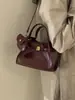 Bolsos de nicho súper populares transfronterizos para mujer 2026 nuevo estilo bolso cruzado tipo cubo bolso pequeño de alta gama exquisito para salir