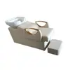 Shampoobed es una cama para lavar el cabello semi-reclinable con lavabo de cerámica para salones de peluquería de alta gama, diseñada para sentarse y lavar el cabello en un entorno de salón.