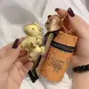 Bolsa Mini de Armazenamento com Bênção de Boa Sorte Versão Q Dourada Porta-Fones de Ouvido Chaves Pingente Presente Lv Moda Monograma
