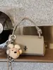 Bestseller Transfronterizo Estilo Coreano Simple Colgante de Oso Bolso Cruzado para Mujer 2026 Nuevo Bolso de Mano con Hombro de Alta Gama