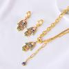 Europeo y americano nuevo color epoxi ojo de palma cadena de suéter acero de titanio pulsera doble capa nicho aretes hebilla collar traje