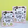 Bolsa de Regalo Blanca de Cartón para el Día de la Madre en stock Venta al por Mayor Plata Caliente 8 de Marzo Día de la Mujer Bolsa de Papel para Envolver Bolsa de Regalo para el Día de las Niñas