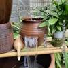 Método antigo de piscicultura aquário ecológico água circulante vaso de barro casa de pátio inauguração de casa nova interior paisagismo aquático criativo ornamentos