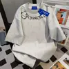 Camiseta Holgada de Manga Corta con Estampado Americano de Hello Kitty para Mujer Verano 2025 con Lindo Graffiti Cuello Redondo