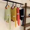 Liquidación, Sin Devoluciones ni Cambios, Estilo Sencillo Conjunto de Dos Piezas: Top sin Mangas de Color Bloqueado con Cuello Halter + Suéter de Punto de Manga Larga Hombros Descubiertos W7032