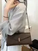 Bolso vintage transfronterizo para mujer 2026 otoño e invierno nuevo bolso baguette, bolso de hombro de diseño nicho de alta gama, bolso bandolera con cadena