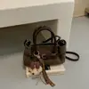 Bolso Pequeño de Mano Moderno y Genial para Mujer 2026 Nuevo Bolso Cubo con Textura Retro Otoño Bolso Simple para el Trabajo de Hombro Único Cruzado
