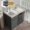 Gabinete de lavandería para balcón de aluminio tipo panal con lavadora integrada, incluyendo una tabla de lavar y un fregadero de piedra de cuarzo artificial con una barrera de agua
