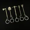 8cm Notas de Tomb Raider Pala de Luoyang Piolet Hacha Pala Modelo de Metal Gadget de Aleación Adorno Llavero
