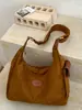 Bolsa Grande de Cor Lisa Personalizada 2026 Novo Estilo Outono Inicial Moda Ombro Único Sobrancelha Bolsa Tote Relaxada para o Dia a Dia