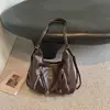 Bolsa Pequeña de Mano Estilo Retro Coreano al por Mayor para Mujer 2026 Otoño Nuevo Color Sólido Bolso de Hombro Simple Mochila de Viaje