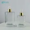 Nueva botella cuadrada plana de 100 ml con fondo grueso para sérum, botella de 50 ml con gotero para aceites esenciales, botella de vidrio cosmético rellenable vacía