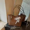 Bolsa de Hombro Cruzada Verano 2026 Nuevo Patrón Tejido para Mujer Estilo Retro Francés para el Trabajo Elegante Bolso Tote de Hombro