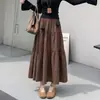 Falda tipo umbrella casual de estilo coreano para principios de otoño, que cubre la cadera, adelgazante, para mujer, falda larga, falda de capas abullonada, negra