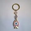 Colgante de Serie Ojo de Diablo Transfronterizo Europeo y Americano Colgante de Llavero de Joyería de Animales Ojo de Hueso con Goteo de Aceite Accesorios de Aleación para Mujeres