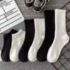 Calcetines para hombre para primavera y otoño, calcetines blancos de algodón de media pantorrilla, calcetines de longitud media, estilo ins moderno, calcetines cortos negros resistentes al olor, calcetines largos para mujer