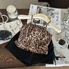 Ropa Infantil Estilo Coreano 2026 Nuevo Verano Conjunto de Dos Piezas para Niñas: Top Camisola con Estampado de Leopardo y Pantalones Cortos Negros con Cordón Moderno