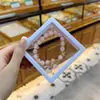Libro Caperucita Roja Mismo Estilo Estudiante Pulsera de Glaseado de Palomitas de Maíz Hecha a Mano con Cuentas Dibujos Animados Cristal Pulsera Infantil Venta al por Mayor Cajas de Regalo