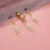 Pinzas eróticas para pezones de mujer, tapones anales, pinzas para pezones para estimulación mamaria, diseño floral de alta gama, borlas largas, entrega en una sola pieza