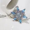 Traje de joyería clásica para boda anillo de copo de nieve pendientes de botón de circón azul para mujer traje de anillo de collar joyería transfronteriza europea y americana