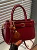 Bolso de mano de diseño nicho de moda nuevo otoño 2026 transfronterizo, bolso de hombro cruzado versátil de color liso simple y elegante
