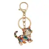 Llaveros lindos de mascotas transfronterizos, varios estilos de gatitos que caminan, aleación de zinc con diamantes de imitación y aceite, llaveros creativos para accesorios de mochila