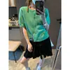 Además, la nueva falda corta estilo pastel de otoño estilo coreano dulce con volantes elástica de cintura alta en línea A MQ1620