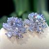 Aretes de mujer de flor de viento dulce y fresco, exquisitos aretes de flor de circonita con diamantes completos, aretes populares de Europa y Estados Unidos, una generación de cabello