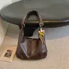 Bolsa Grande Capacidade Feminina Outono 2026 Nova Bolsa de Ombro Único de Alto Valor Bolsa Tote Cor Sólida Retro Relaxada Fashion