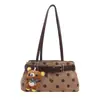 Tendencia transfronteriza bolso pequeño cuadrado de mano para principiantes bolso de mujer otoño 2026 nuevo bolso de hombro único con lunares y bloques de color bolso de axila para ir al trabajo