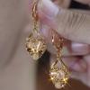 Diseño de otoño e invierno lleno de piedra ojo de gato de diamante pendientes de amor estilo niche nuevo popular pendientes elegantes combinan con todo de alta calidad